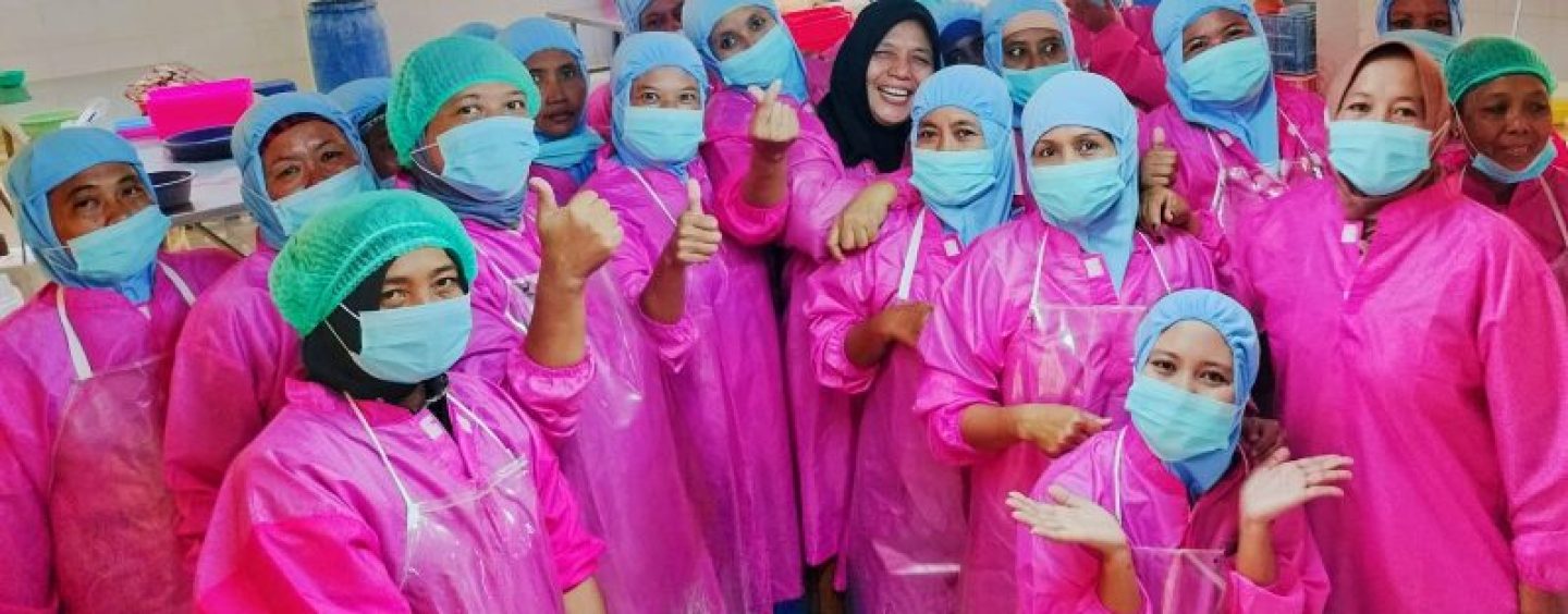 Happiness women working on miniplant processing blue swimming crab in Gresik